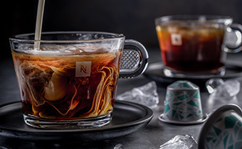 coffee being poured in glass